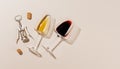 Two wine glasses alongside a corkscrew and several corks Royalty Free Stock Photo
