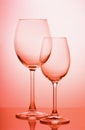 Two wine glasses on a colored gradient background Royalty Free Stock Photo