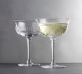 Two wine glasses with red wine close up on grey background Royalty Free Stock Photo