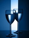 Two wine glasses silhouette full on blue background. Trendy color of the year 2020 Royalty Free Stock Photo