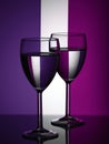 Two wine glasses silhouette full on colored background. Alcohol beverage Royalty Free Stock Photo