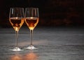 Two wine glasses standing on stone surface Royalty Free Stock Photo