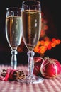 Two wineglasses of champagne, cinnamon and new year`s decoration