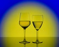 Two wineglasses with white wine on blurred yellow background Royalty Free Stock Photo