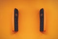 Two wireless cordless telephone, dect cordless phone wireless phone, radiotelephone, radio phone on orange background Royalty Free Stock Photo