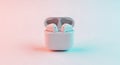 Wireless earbuds resting inside open charging case on gradient background Royalty Free Stock Photo