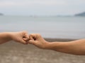 Two woman Alternative handshakes fist clenched hand greeting in the situation of an epidemic covid 19, coronavirus new normal