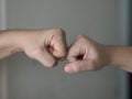 Two woman Alternative handshakes Fist collision Bump greeting in the situation of an epidemic covid 19, coronavirus