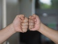 Two woman Alternative handshakes Fist collision Bump greeting in the situation of an epidemic covid 19, coronavirus