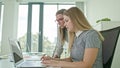 Two Woman Discussing Ideas Using Laptop Royalty Free Stock Photo