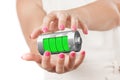 Two Woman Hands Protecting Abstract Charging Battery with Charge