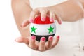 Two Woman Hands Protecting Syria Flag Earth Globe Sphere. Royalty Free Stock Photo