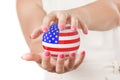 Two Woman Hands Protecting USA Flag Earth Globe Sphere. Royalty Free Stock Photo