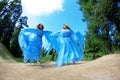 Two woman, twins in the forest Royalty Free Stock Photo