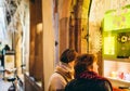 Two women admiring the windows shopping for Christmas