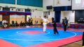 Two women athletes competes during the `Sukan Kombat 6 Penjuru` competition or fighting combat games.