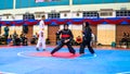 Two women athletes competes during the `Sukan Kombat 6 Penjuru` competition or fighting combat games.