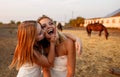 Two women best friends having fun in the village. Outdoor portrait of two happy sisters. Royalty Free Stock Photo