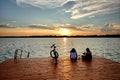 Two Women With Bike On Palic Lake At The Sunset, Serbia Royalty Free Stock Photo