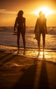 Two Women Bikini Surfers With Surfboard Sunset or Sunrise Beach Royalty Free Stock Photo