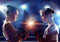 Two women boxing in ring