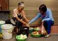 Two women buying and selling fresh eggs in the Old Quarter of Hanoi, Vietnam