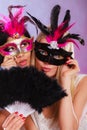 Two women with carnival venetian masks Royalty Free Stock Photo