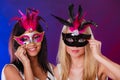 Two women with carnival venetian masks Royalty Free Stock Photo