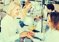 Two women clients having manicure done in nail salon Royalty Free Stock Photo