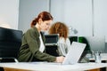 Two women coding together in a high-tech office, showcasing teamwork, software development, and female empowerment Royalty Free Stock Photo
