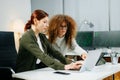 Two women coding together in a high-tech office, showcasing teamwork, software development, and female empowerment Royalty Free Stock Photo