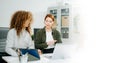 Two women coding together in a high-tech office, showcasing teamwork, software development, and female empowerment Royalty Free Stock Photo