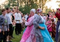 Two women in colorful Russian costumes, dancing for the time of the annual Intl festival.