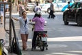 Two women communicate on street in Nha Trang in Vietnam