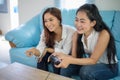 Two women Competitive friends playing video games and excited ha Royalty Free Stock Photo