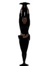 Two women contortionist exercising gymnastic yoga silhouette