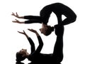 Two women contortionist exercising gymnastic yoga silhouette