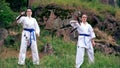 Two women doing synchronised moves with nunchucks