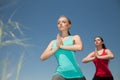 Two women doing yoga outdoors photo yoga shows poses Royalty Free Stock Photo