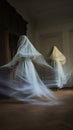 two women dressed in white are dancing in a room