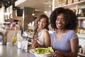 Two Women Enjoying Lunch Date In Delicatessen Restaurant