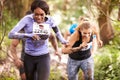 Two women enjoying a run in a forest at an endurance event