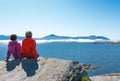 Two women enjoying view at fjord Royalty Free Stock Photo