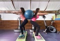 Two women exercise gym lunge ball weightsgym exercise ball Royalty Free Stock Photo