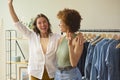 Two Women Friends Celebrating Successful For Their Online Fashion Business From Home Together Royalty Free Stock Photo