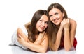 Two women friends laughing with a perfect white teeth with a green background Royalty Free Stock Photo