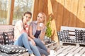 Two women friends talking holding coffee cups Royalty Free Stock Photo