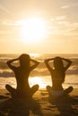 Two Women Girls Sitting Sunrise Sunset Bikini Beach Royalty Free Stock Photo