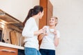 Two women gossiping on the kitchen Royalty Free Stock Photo