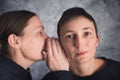 Two women gossiping